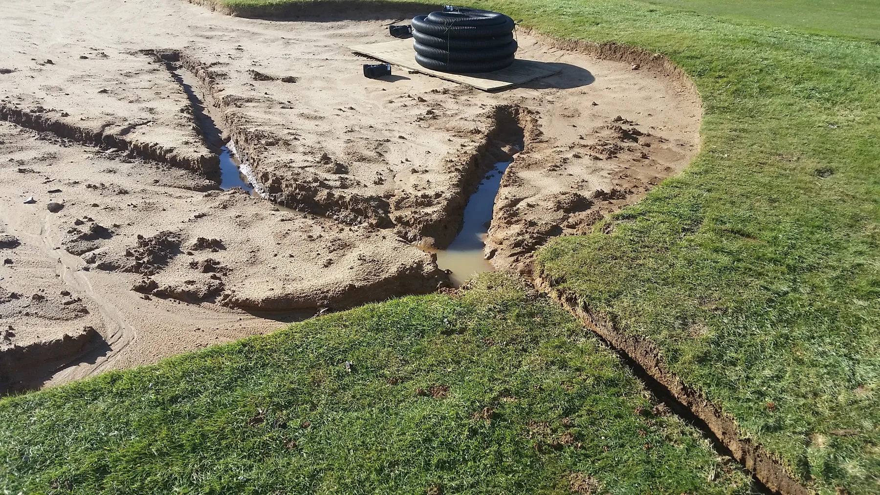 Water in newly cut drainage trenches