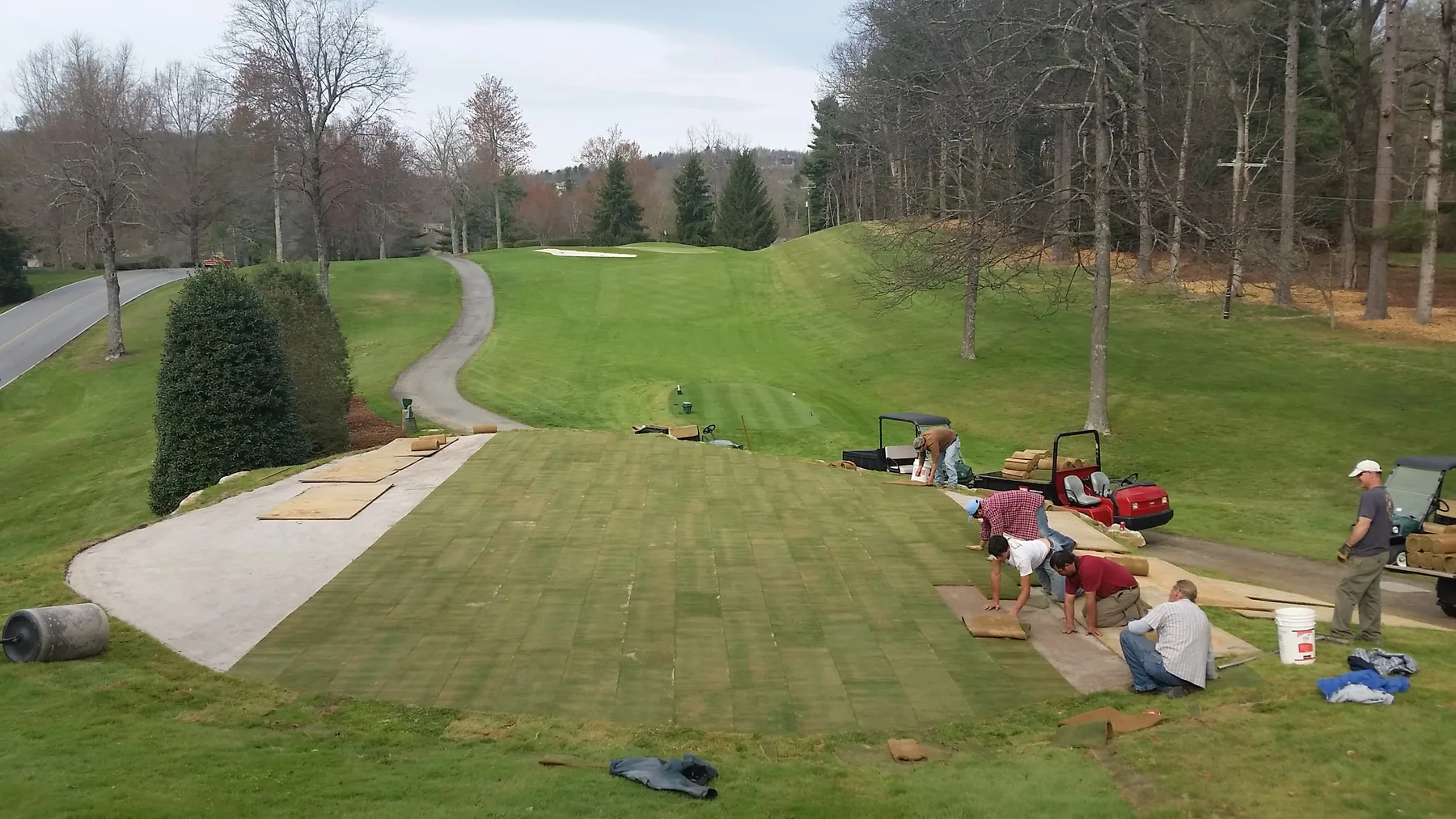 Crew installing sod