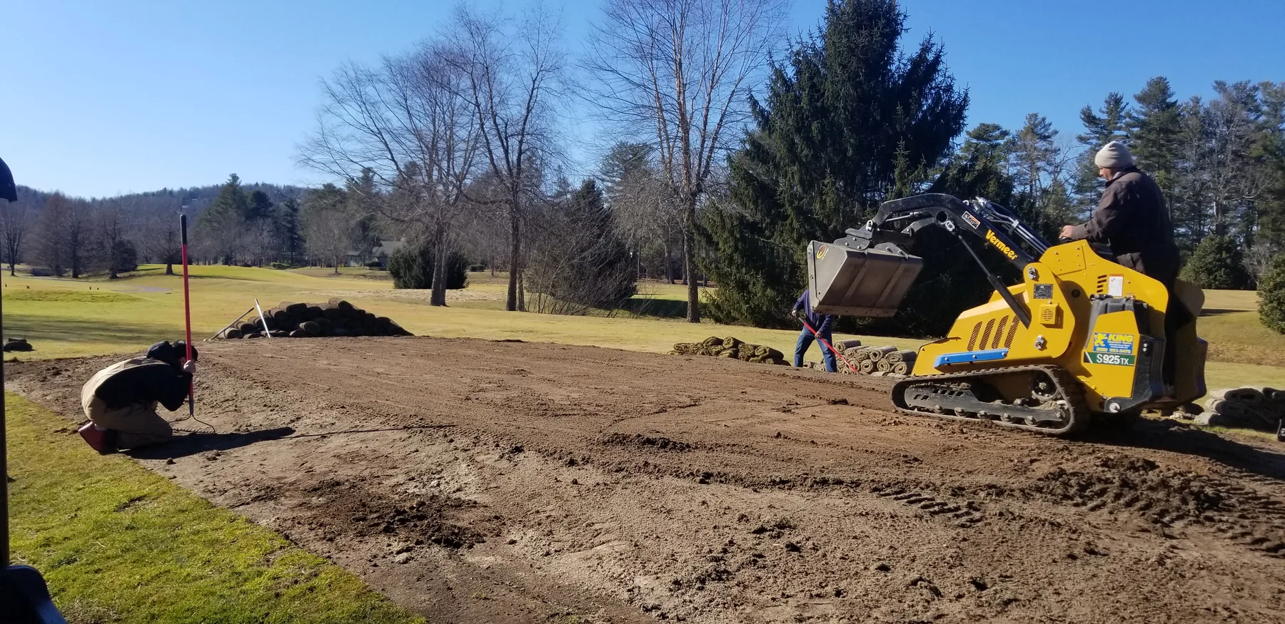 Track loader spreading mix